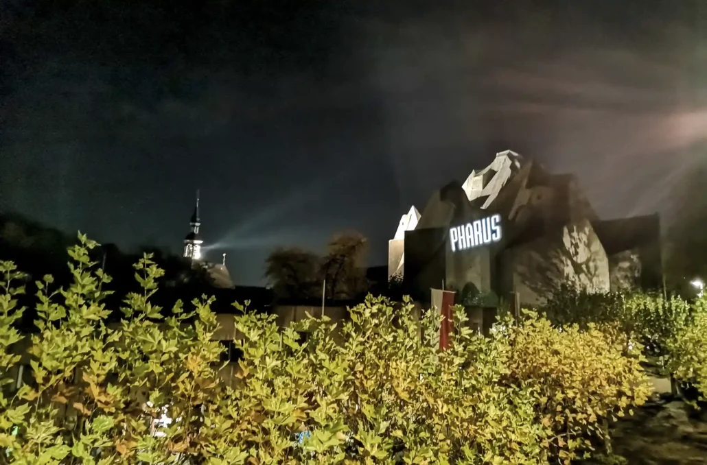 PHARUS lettering projected onto the Mariendom Neviges at night